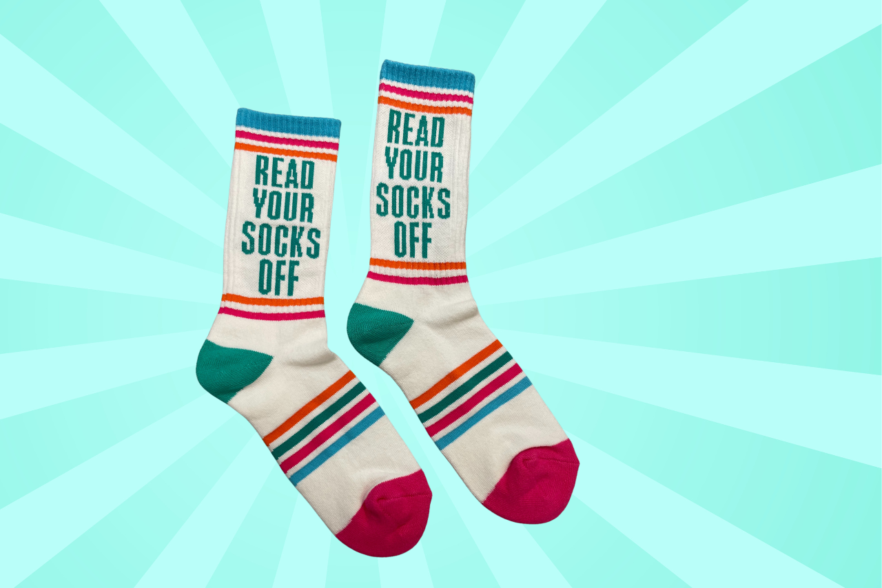 Read Your Socks Off Socks on a teal background. 