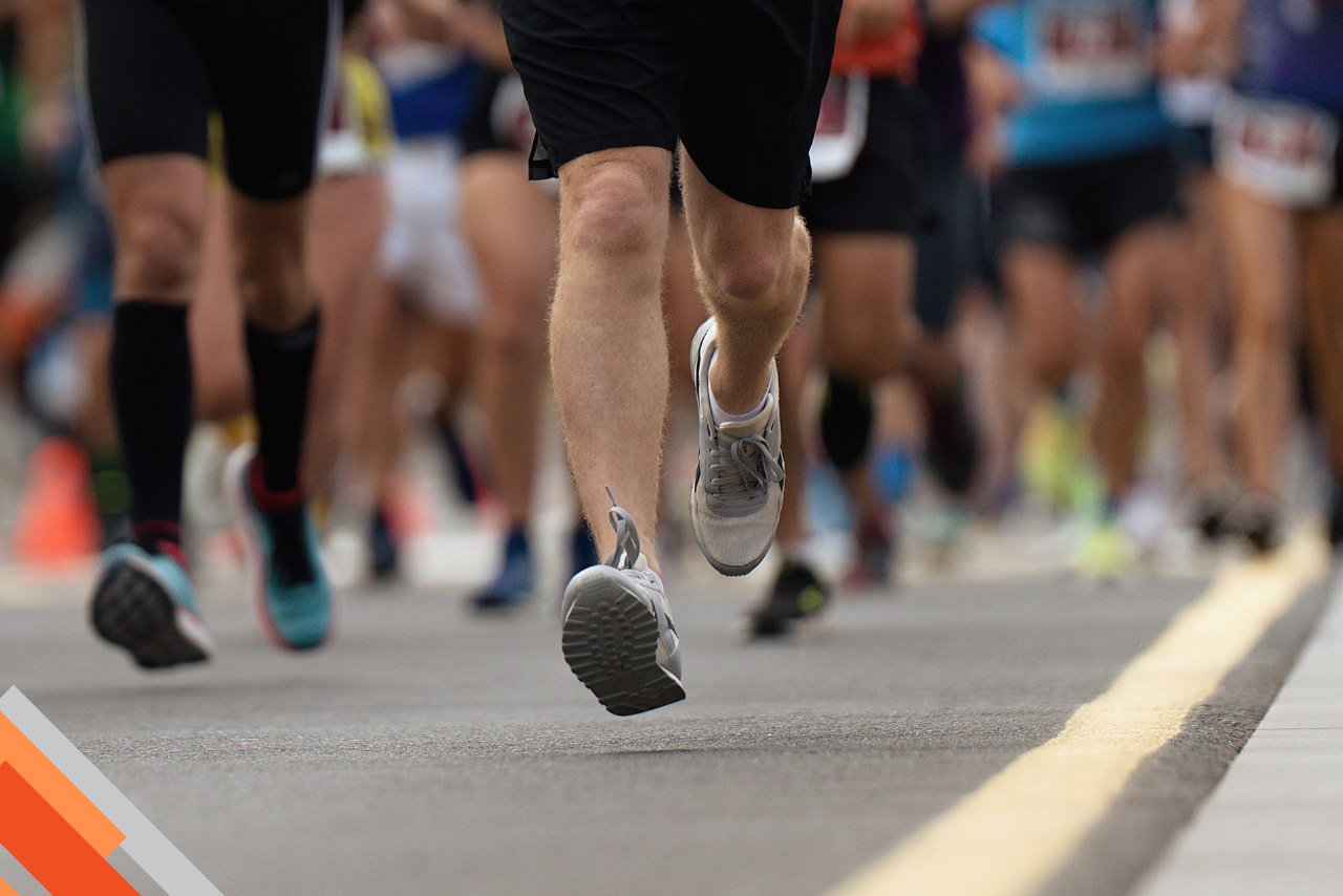 Group of people running a race. 