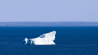 Photo of an iceberg in the ocean. 